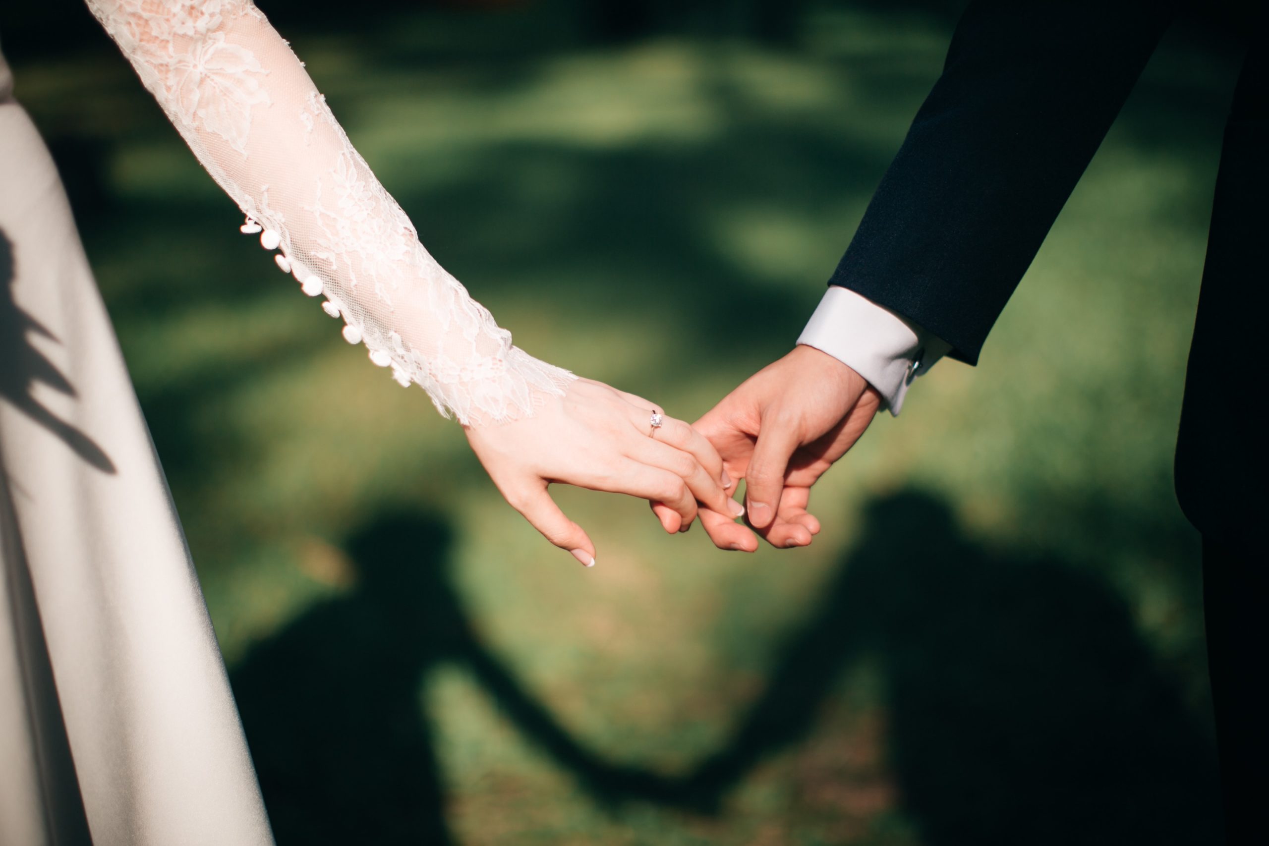 Couple holding hands, marriage, wedding